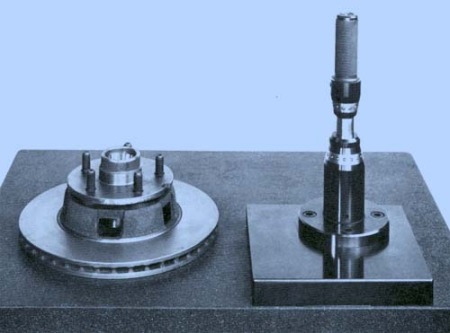 This two-piece interlocking arbor locates in the tapered inboard and outboard cups of a disc brake